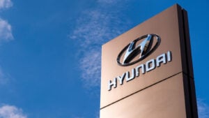 Hyundai (HYMTF) sign for car dealership with blue sky in background, symbolizing HYMTF stock