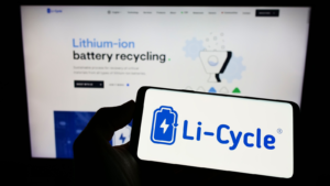 Person holding cellphone with logo of battery recycling company Li-Cycle Corp.(LICY) on screen in front of business webpage. Focus on phone display. Unmodified photo. EV stocks