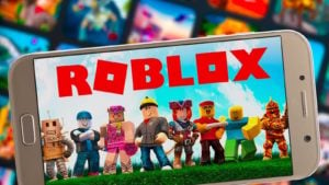 An illustration of the Roblox game is displayed on a smartphone screen.