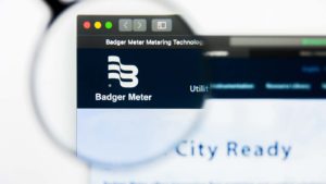 A magnifying glass zooms in on the website for Badger Meter Inc (BMI).