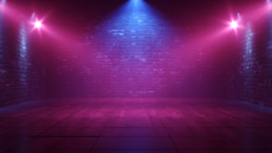an empty stage at a night club with blue and purple lights