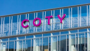 The Coty (COTY) logo on a glass office in Poland.