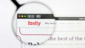 A magnifying glass zooms in on the Fastly (FSLY) website.