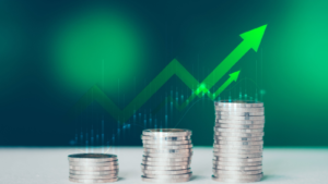 Coins stack of money on saving, the step of the financial stock market, graph and rows of coins, business investment on a green background, Economy stock market growth of financial recovery. Growth stocks