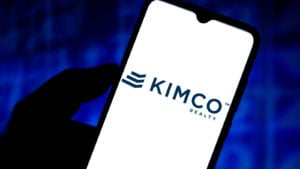 The Kimco Realty (KIM) logo displayed on a smartphone screen.