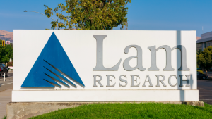 The logo for Lam Research Corporation (LRCX) displayed on a white billboard