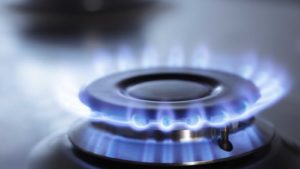 Image of a gas burner with a blue flame