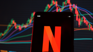 Netflix (NFLX) stock index is seen on a smartphone screen. It is an American subscription streaming service and production company. reliable blue-chip stocks