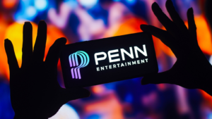 In this photo illustration, the Penn Entertainment (PENN) logo is displayed on a smartphone mobile screen.
