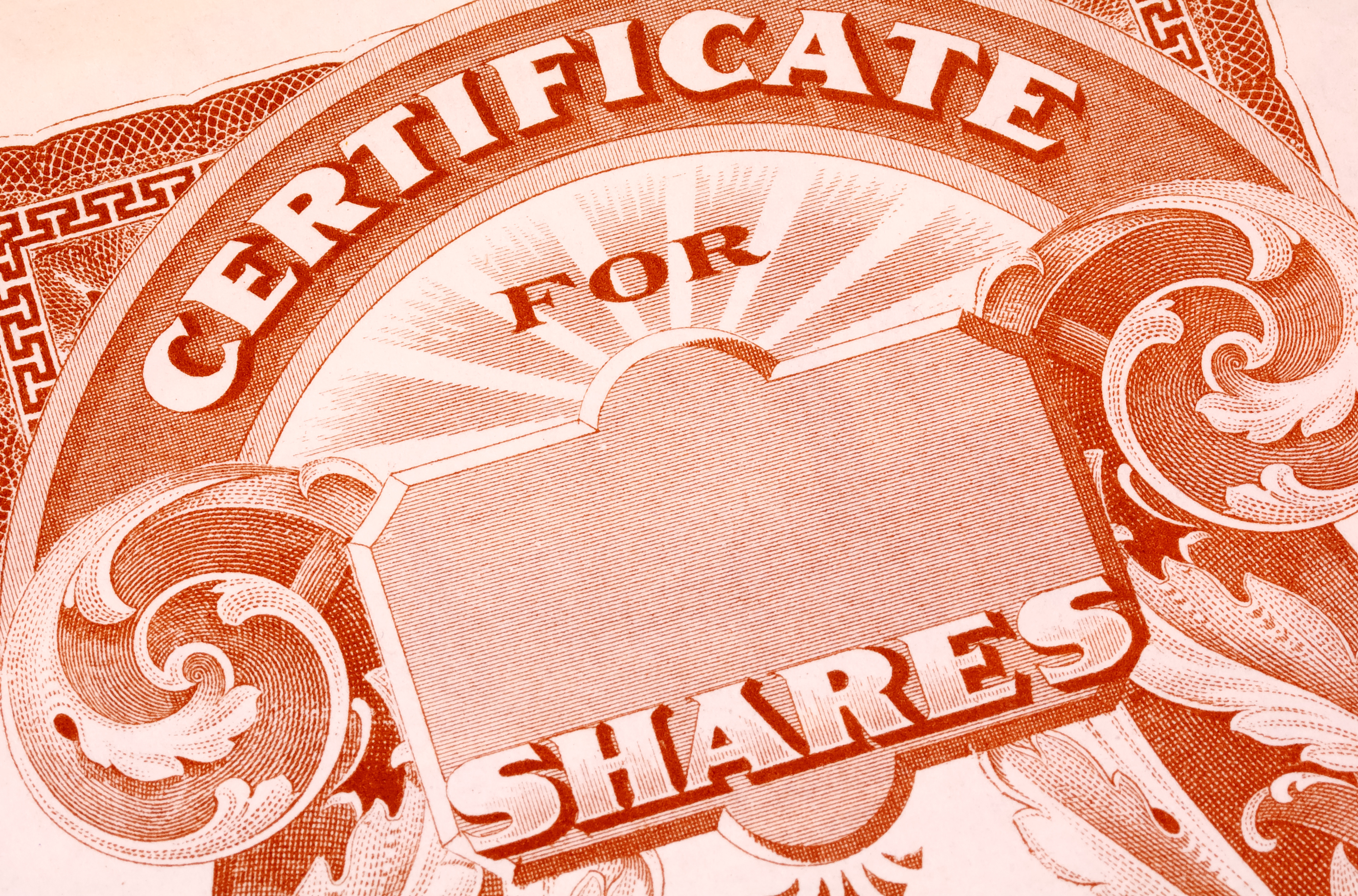 A blank paper certificate for shares of a publicly traded company.