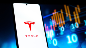 Tesla (TSLA) on phone screen stock image.