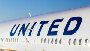 The side of a United Airlines (UAL) plane with "united" written above passenger windows. Represents airline stocks.