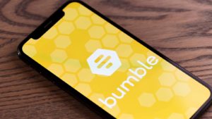 The logo for Bumble (BMBL) is displayed on a smartphone screen.