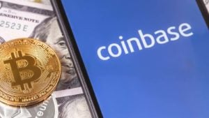 The Coinbase (COIN stock) logo on a smartphone screen with a BTC token. Crypto winter is setting in.