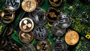 image of many types of cryptocurrency laying on a motherboard