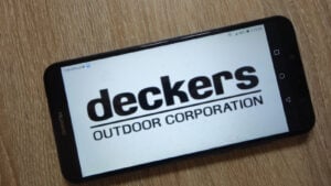 Deckers Outdoor (DECK) logo displayed on smartphone screen
