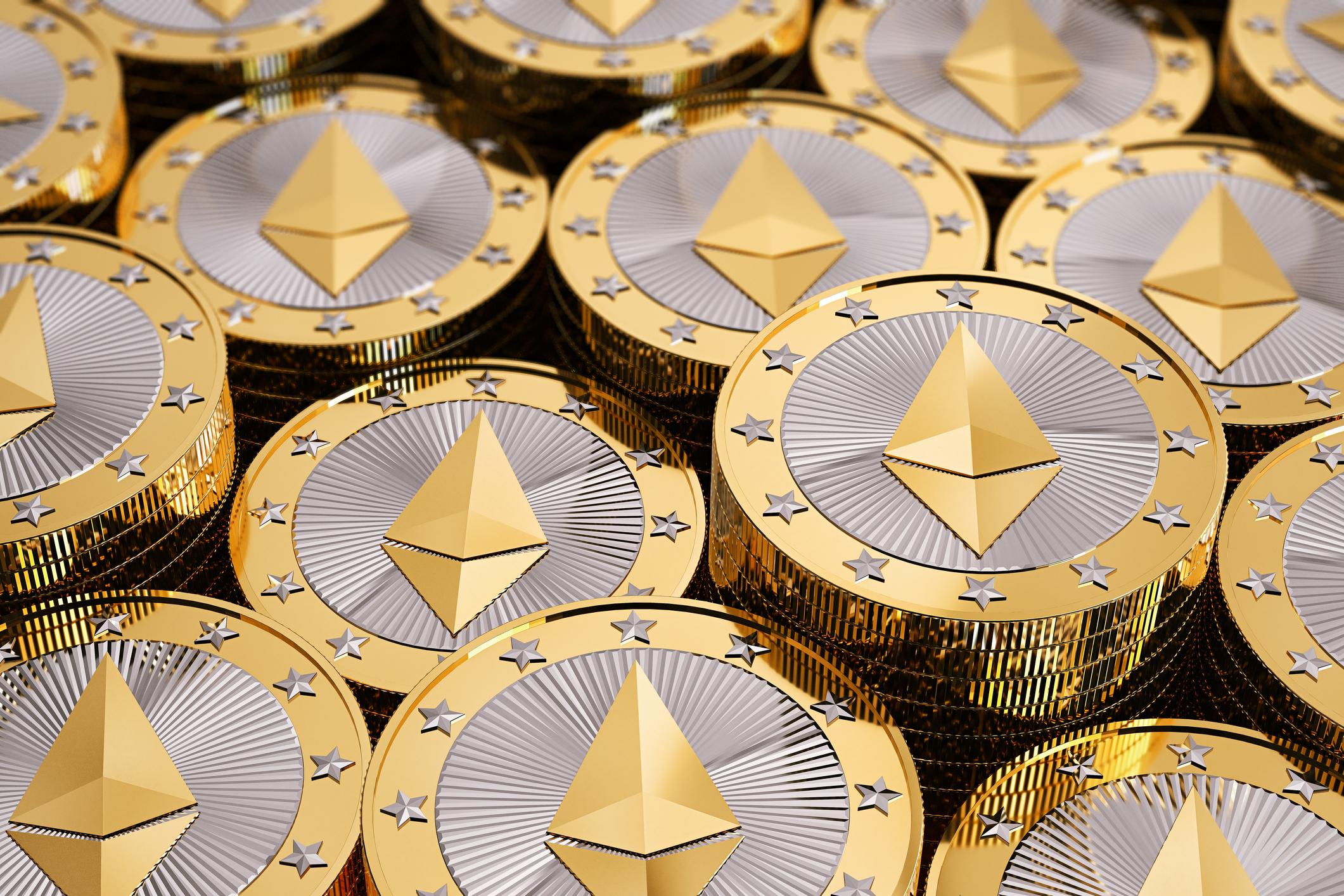 Ethereum gold coins in a pile.