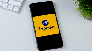 Expedia app logo on a smartphone screen. EXPE stock