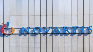 Novartis (NVS) logo on a corporate building during daylight