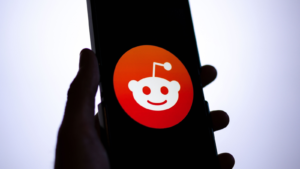 Reddit (RDDT) app logo on a smartphone screen.