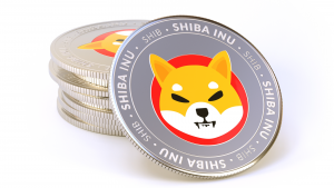 Stack of Shiba Inu (SHIB-USD) coins isolated on white background.