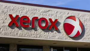 A photo of the Xerox logo on a storefront.
