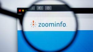 Illustrative Editorial of ZOOMINFO.COM website homepage. ZOOMINFO logo visible on display screen.