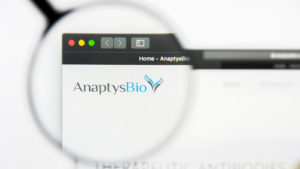 A magnifying glass zooms in on the logo for AnaptysBio, Inc. (ANAB)