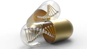 a gold and clear pill capsule contains a representation of a DNA molecule