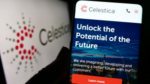 Person holding cellphone with website of Canadian electronics company Celestica Inc. (CLS) on screen in front of logo. Focus on center of phone display. Unmodified photo.