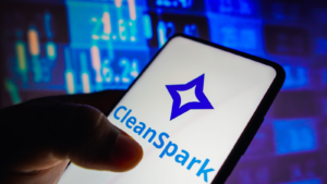 In this photo illustration, the CleanSpark (CLSK) logo seen displayed on a smartphone screen