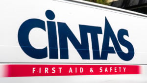 Image of the Cintas (CTAS) logo on the side of a white van.