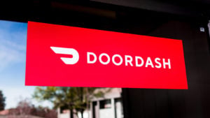 Close up of Doordash (DASH) logo and symbol displayed at the entrance to one of their offices