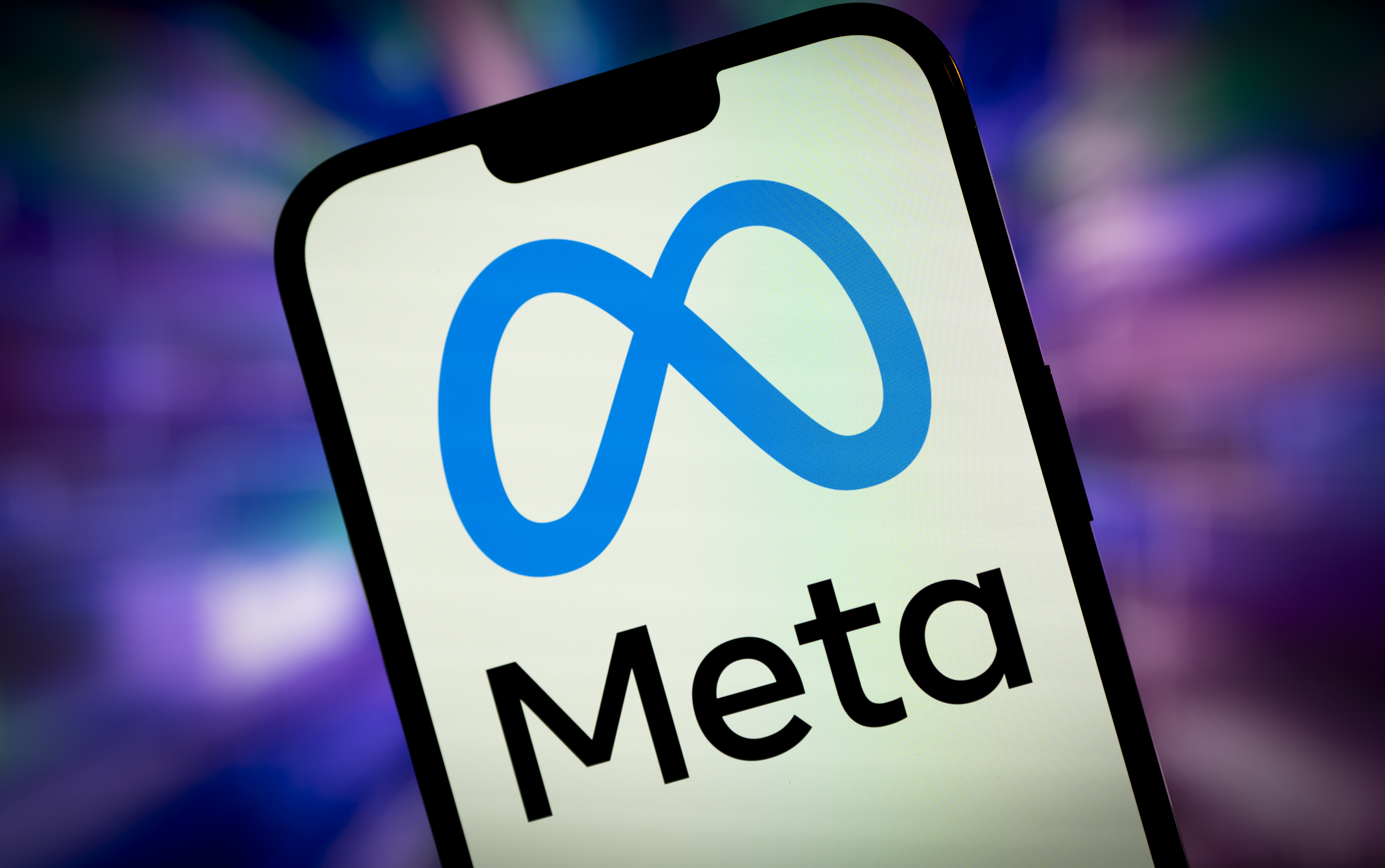 A smartphone displaying the Meta logo.
