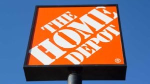 Home Depot (HD) sign backdropped by blue sky