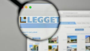 A magnifying glass is focused on the logo for Leggett & Platt on the company's website.
