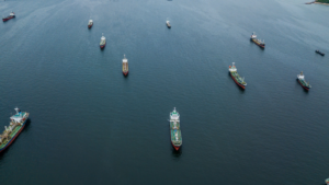 Crude oil tanker and LPG Loading in port at sea view from above. Aerial view oil tanker ship shot from drone. Oil prices, oil shipping, oil stocks.