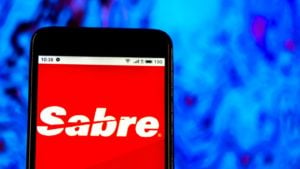The logo for Sabre Corporation (SABR) is displayed on a smartphone screen.