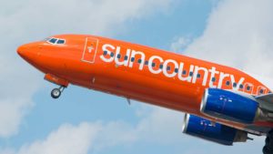A Sun Country Airlines plane taking off.