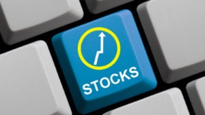 stock button on a computer keyboard (representing best investments to start 2021. stocks to buy