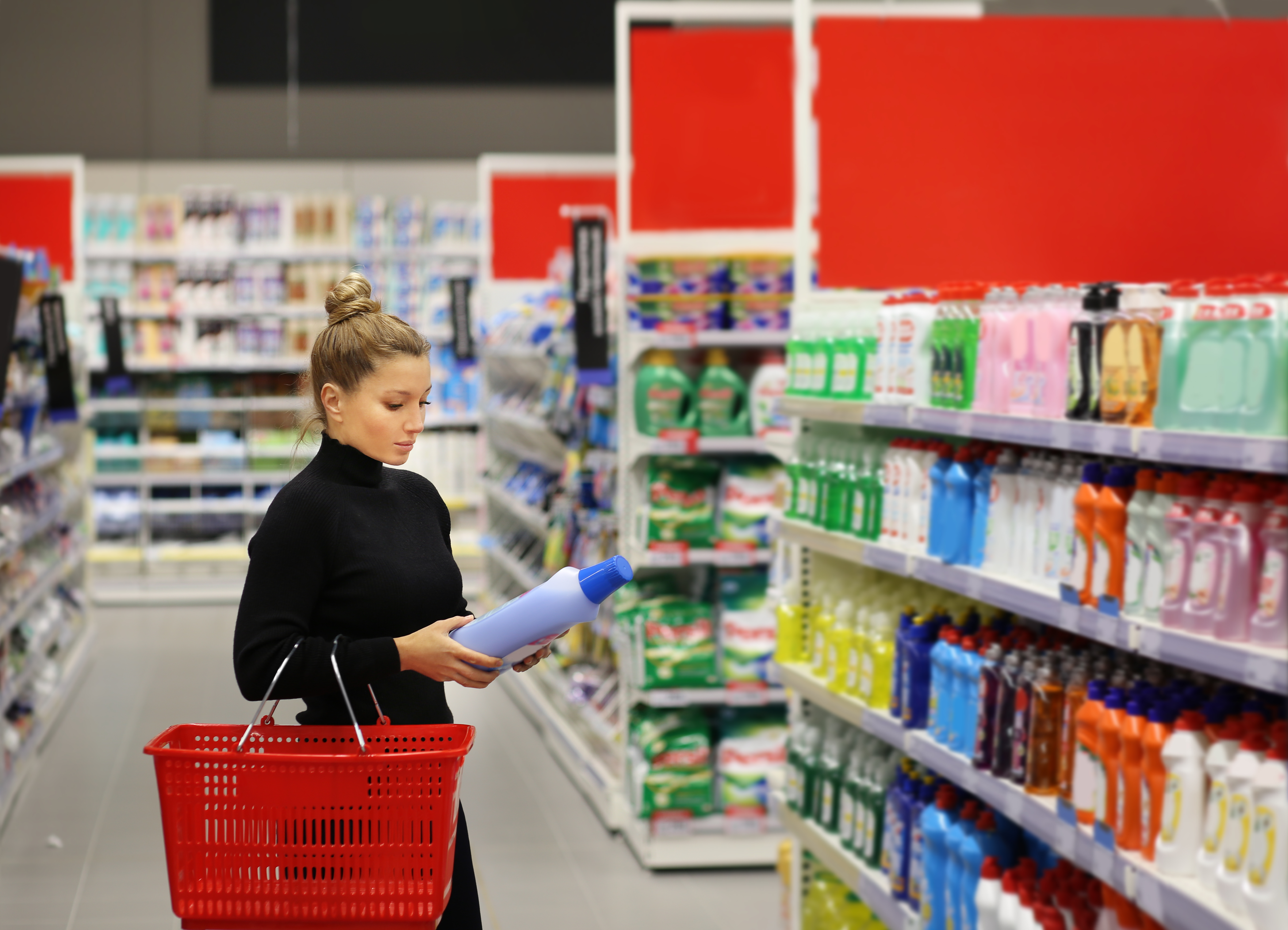 A woman shopping in a drugstore.