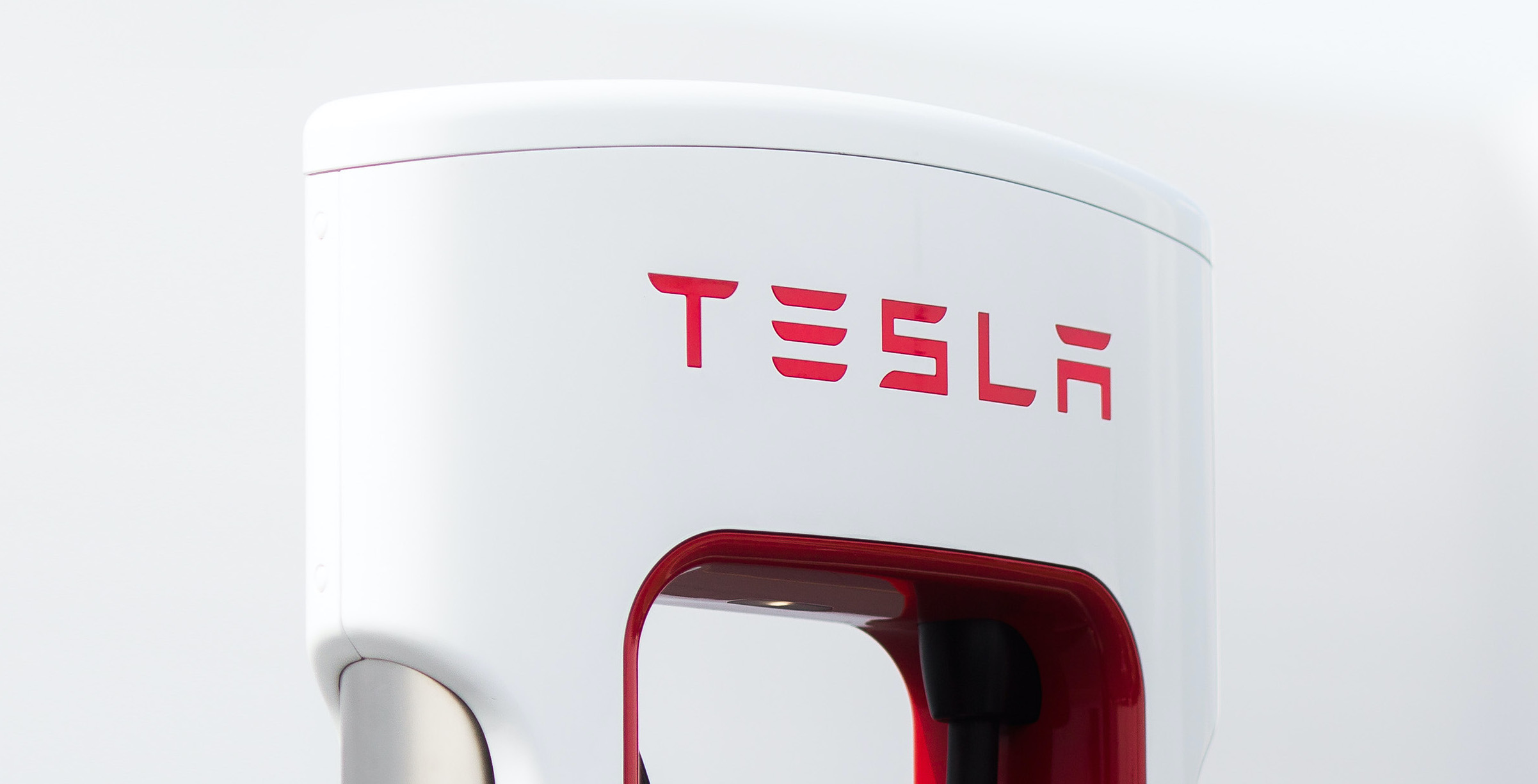 A Tesla logo on an electric vehicle charger.