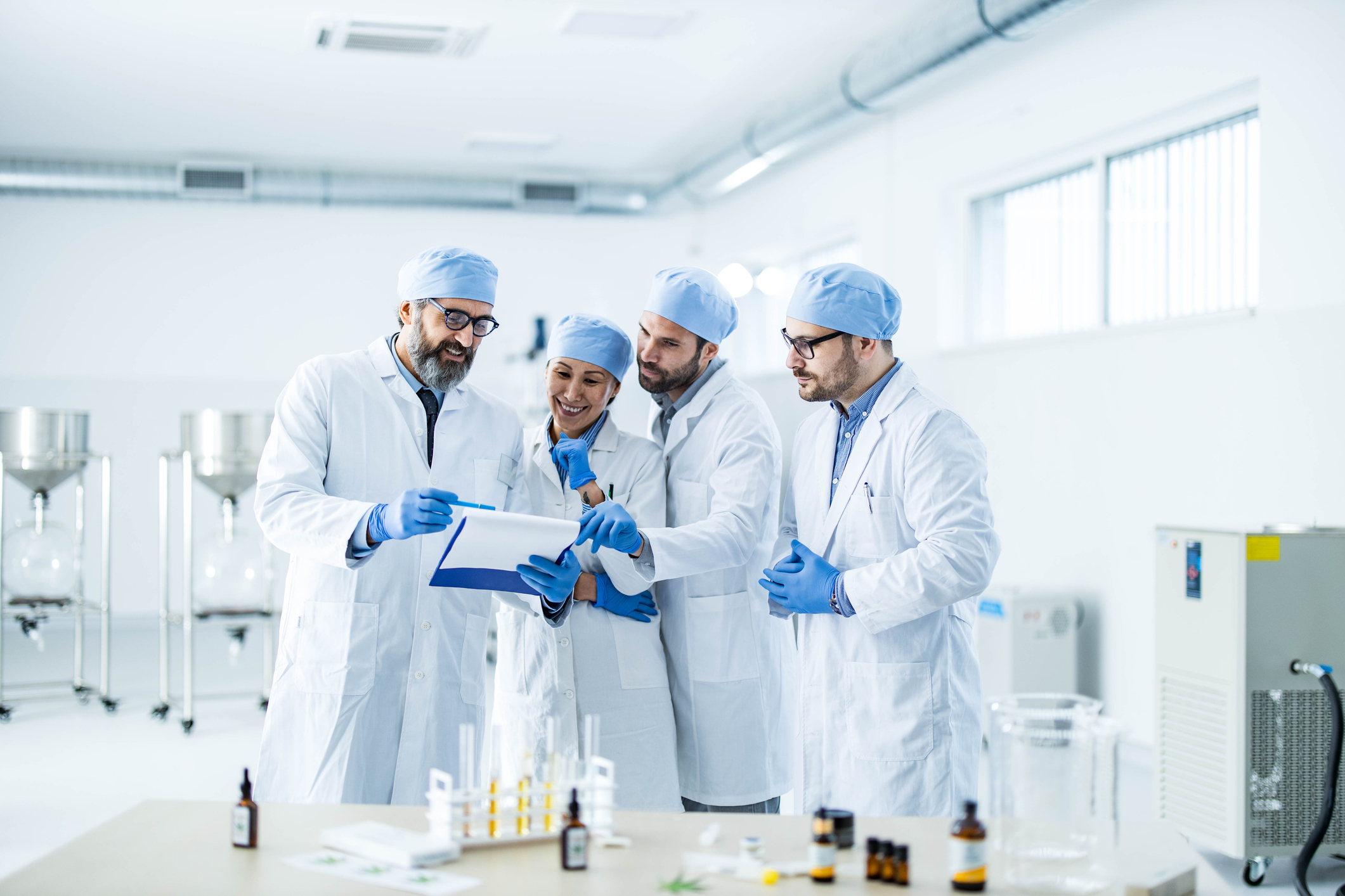 People in a lab reviewing data.